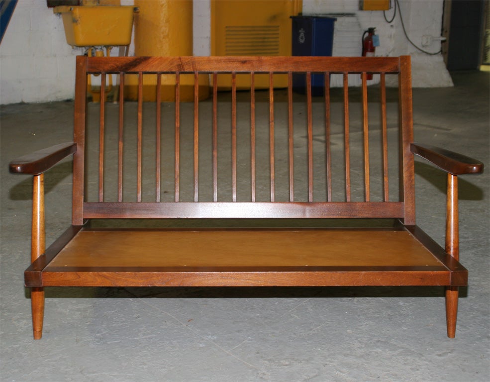 A beautiful example of Nakashima's studio work.This settee has a rich walnut color in original condition.