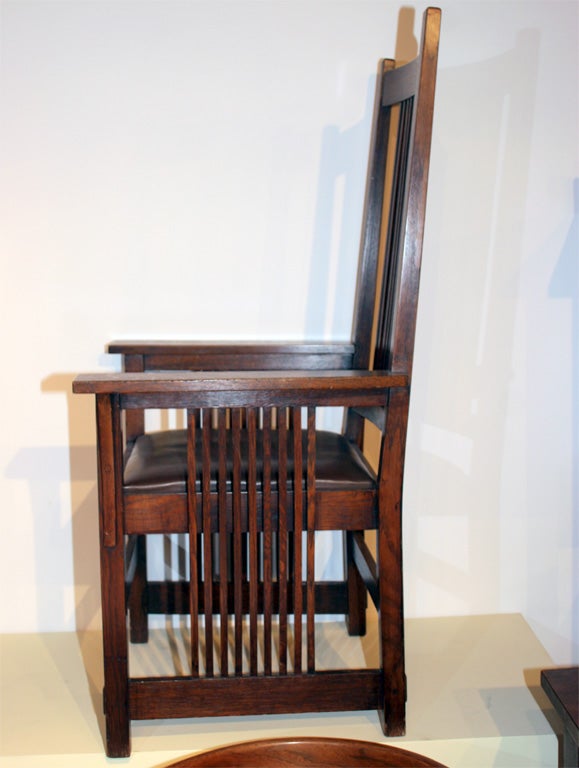 A beautiful large spindle back arm chair,having eleven thin spindles running up back and nine under each arm of chair. Long pinned corbels under each arm.This is one of Stickley's most desirable forms.One of the mission,Arts&Crafts periods prized