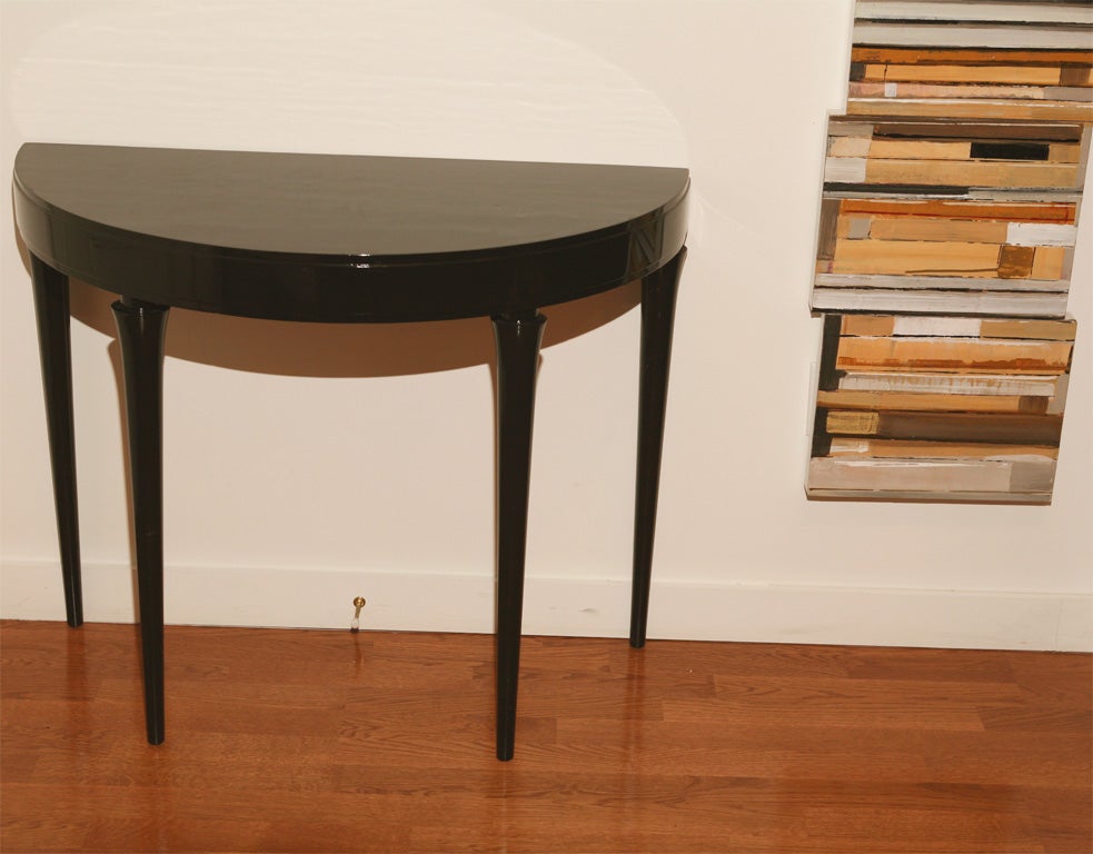 Black piano lacquered demi lune console