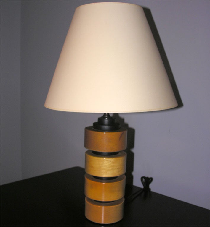 Pair of stacked blond and black painted wood lamps Signed 
