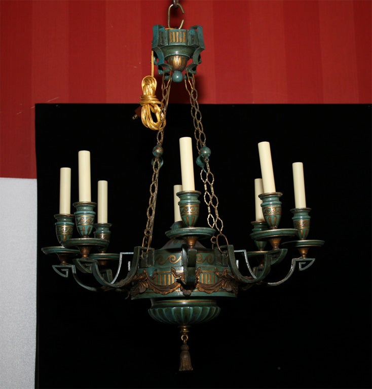 Painted wood and gilt iron eight light chandelier with classical motif.  Newly wired.