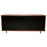 Pastoe sliding door cabinet with black doors and teak case