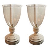 large glass globes with wooden stands