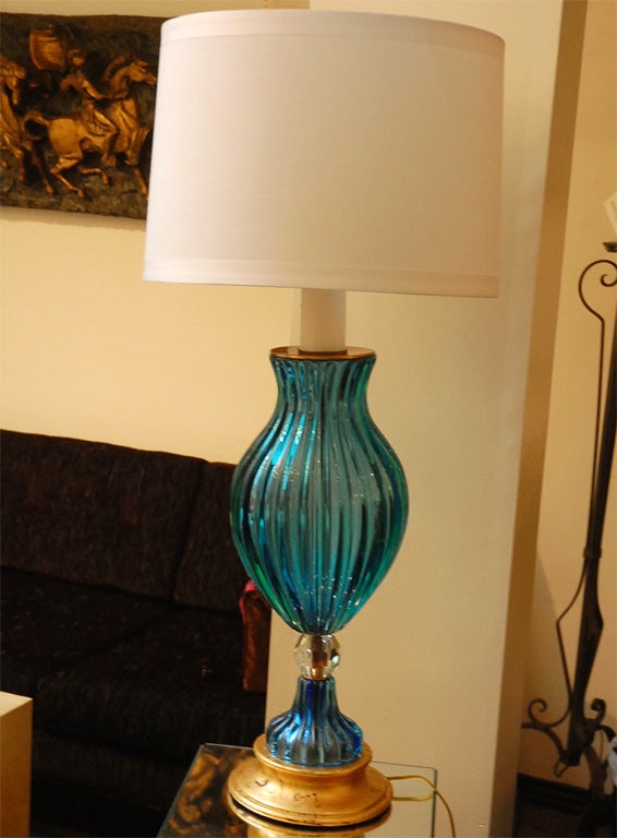 Murano glass table lamp with gold leaf on wood base. Newly rewired. White candle top detail below bulb socket. Shade not included