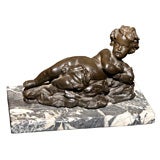 BRONZE FIGURE OF A CHERUB MOUNTED ON A MARBLE BASE