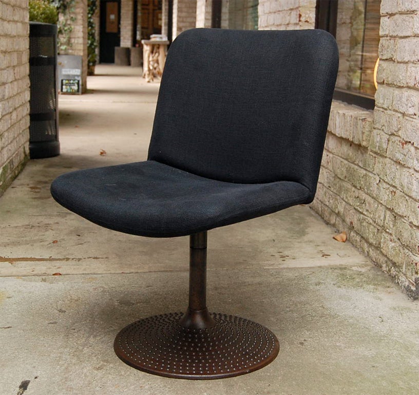 Three Dining Chairs  by IImari Tapiovaara. Newly re-upholstered in Black Belgian Linen. Cast Iron Swiveling Metal Base
