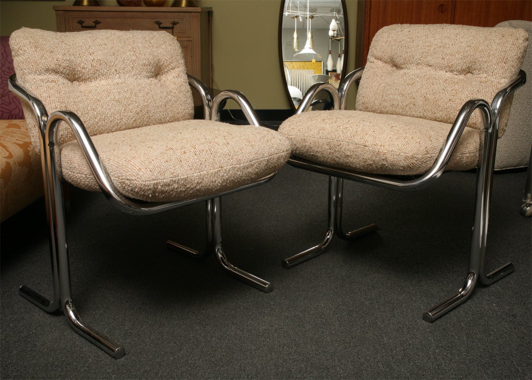 SOLD JULY 2011 1970's California styling here with these six chromed shaped tubular steel dining chairs by Jerry Johnson for Landes.  Original tufted oatmeal fabric cushions rest on a canvas sling.  Very good original condition ready for your fabric