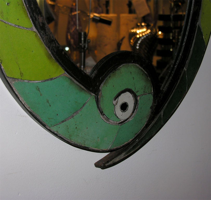 Oval mirror contained with ceramic tile surround