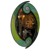 Oval mirror contained with ceramic tile surround
