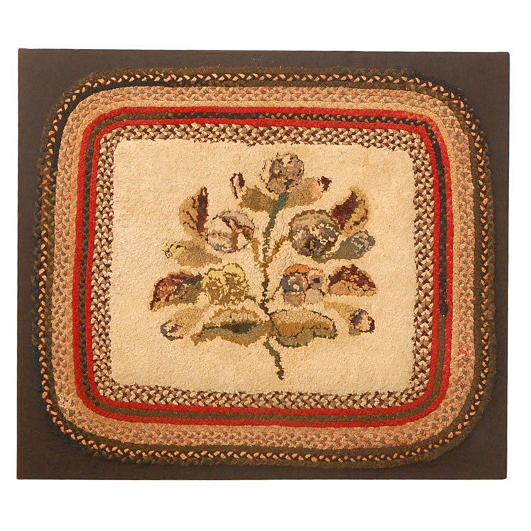 20TH C. MOUNTED FOLKY FLORA HAND HOOKED RUG WITH BRAIDED BORDER