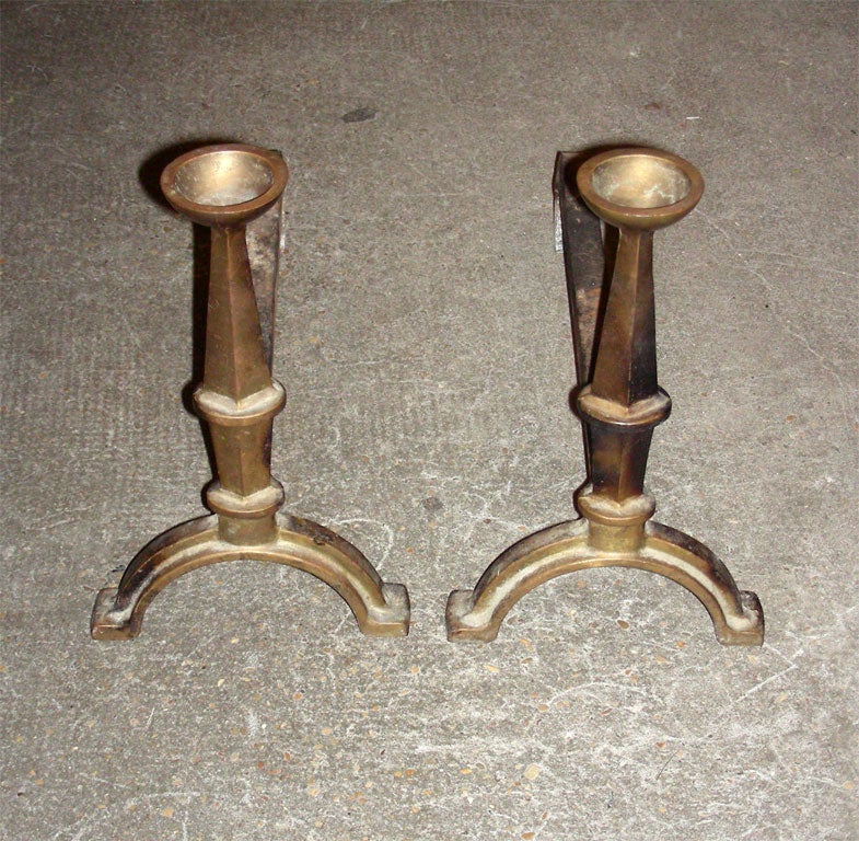 Two 1940s andirons in iron and bronze.