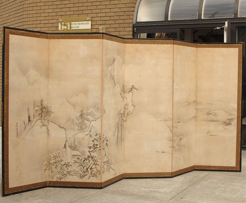 A large and beautiful Japanese screen decorated with a fanciful landscape.
