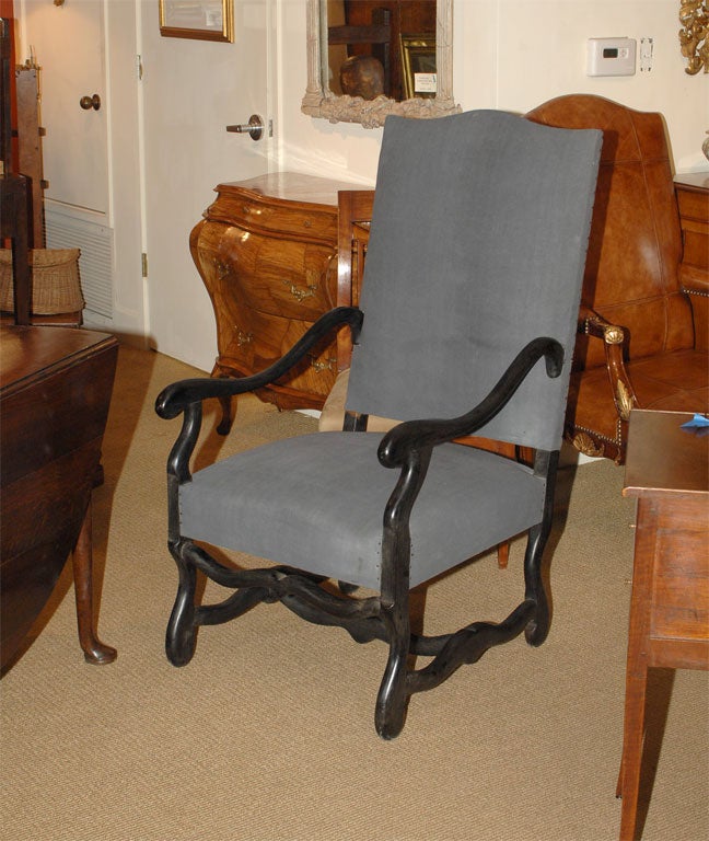 A pair of vintage black painted armchairs circa 1920 done in the early 18th century style.