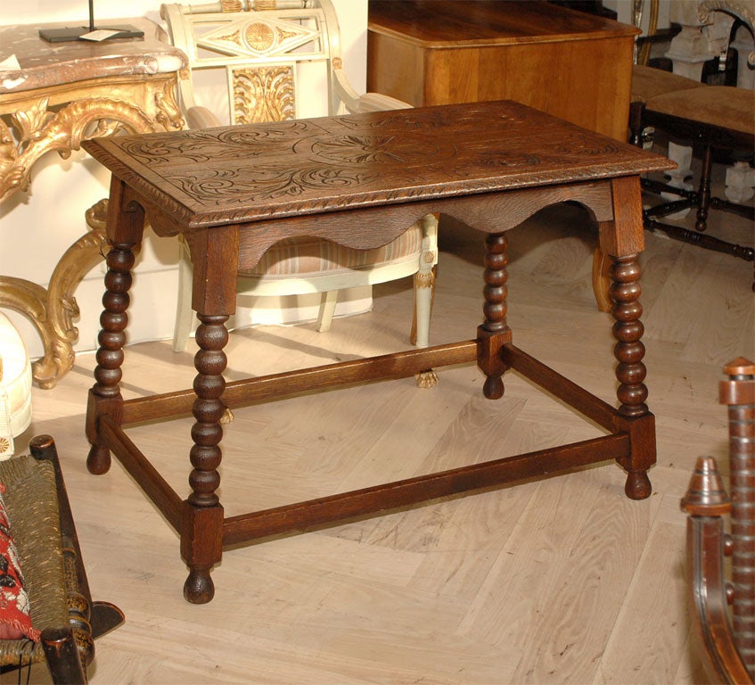 Spanish oak trestle table with carved top standing on ball turned legs circa 1900