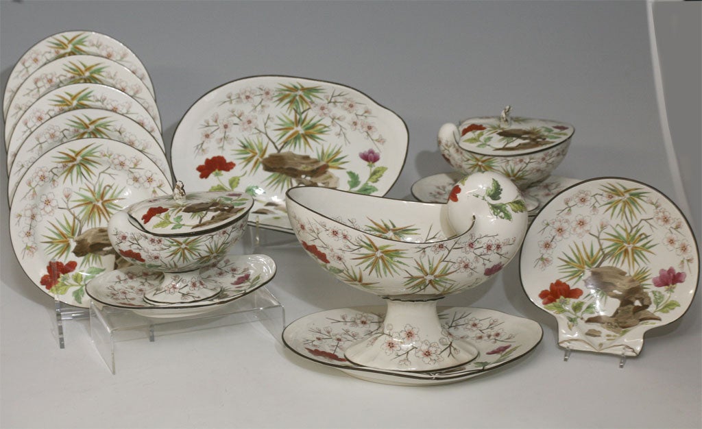 This is an early Wedgwood Pearlware shell dessert service consisting of 15 pieces all with a shell motif. The unusual hand-painted polychrome enamel decoration is an early version of the aesthetic movement/Chinoiserie. The set has eight dessert