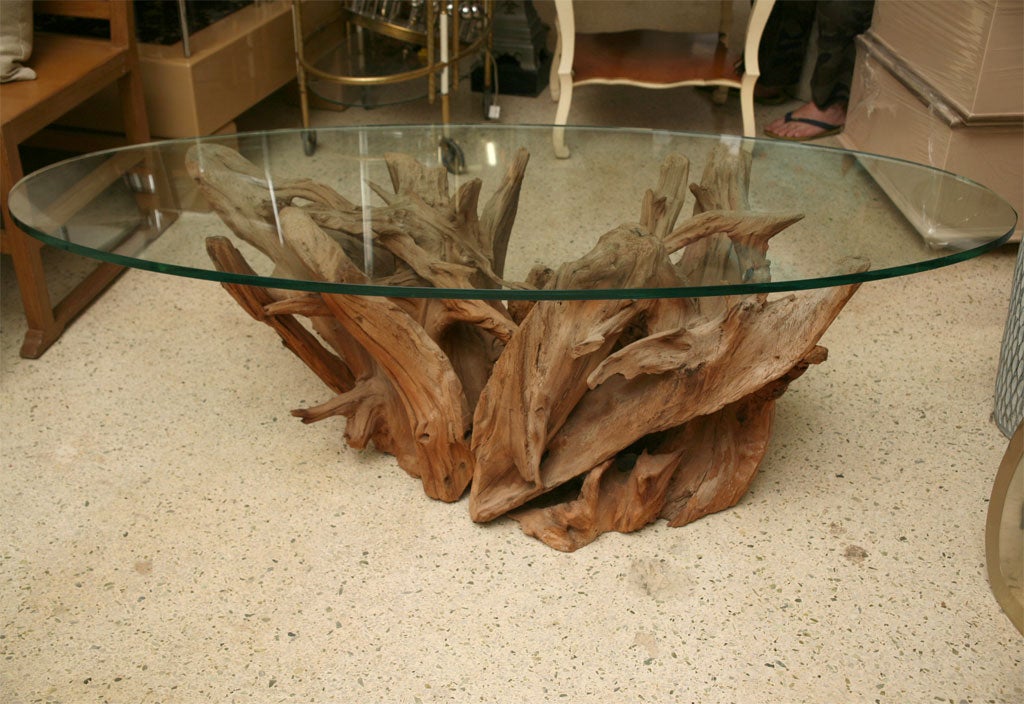 Lovely, soft patina on this vintage driftwood coffee table with an oval, half-inch glass, 