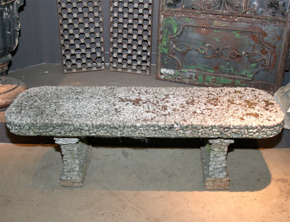 Unusual English cast stone slab top garden seat constructed in three sections encrusted with small stones. Great weathered surface.