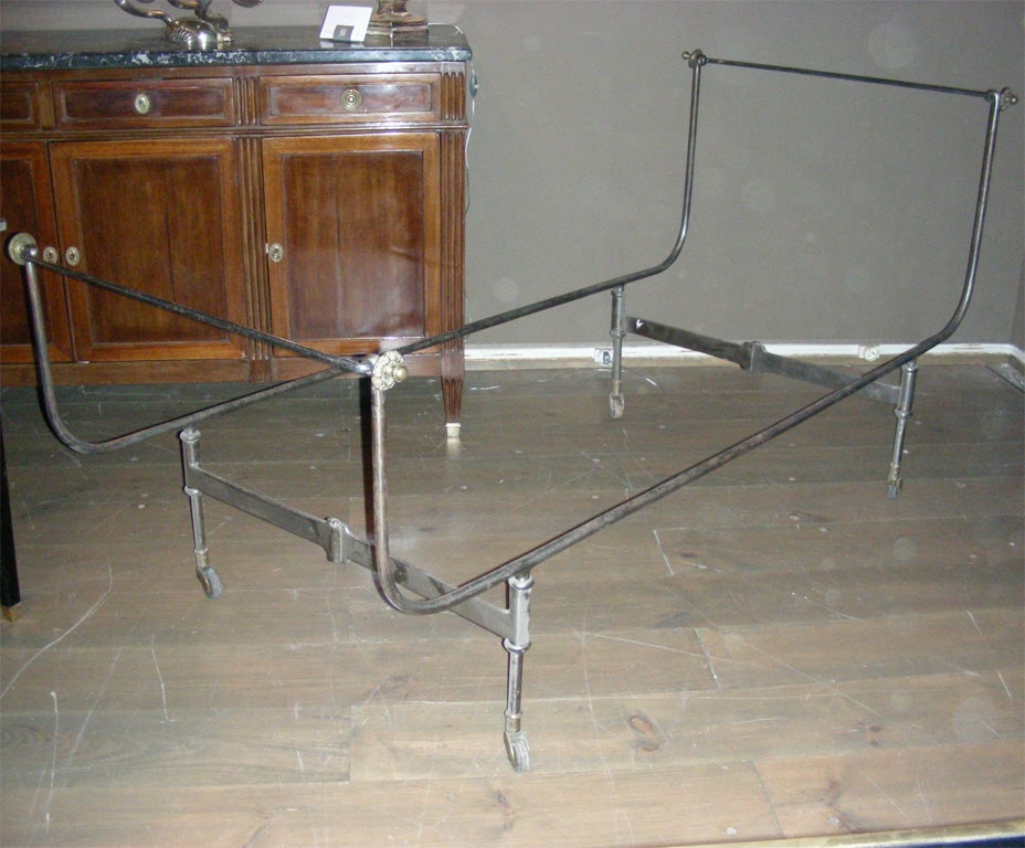 1830-1860 folding officer's campaign bed in steel with bronze fitted legs on casters. Could be transformed into a day bed. Height of foot end 78 cm. Height given below is for head end.