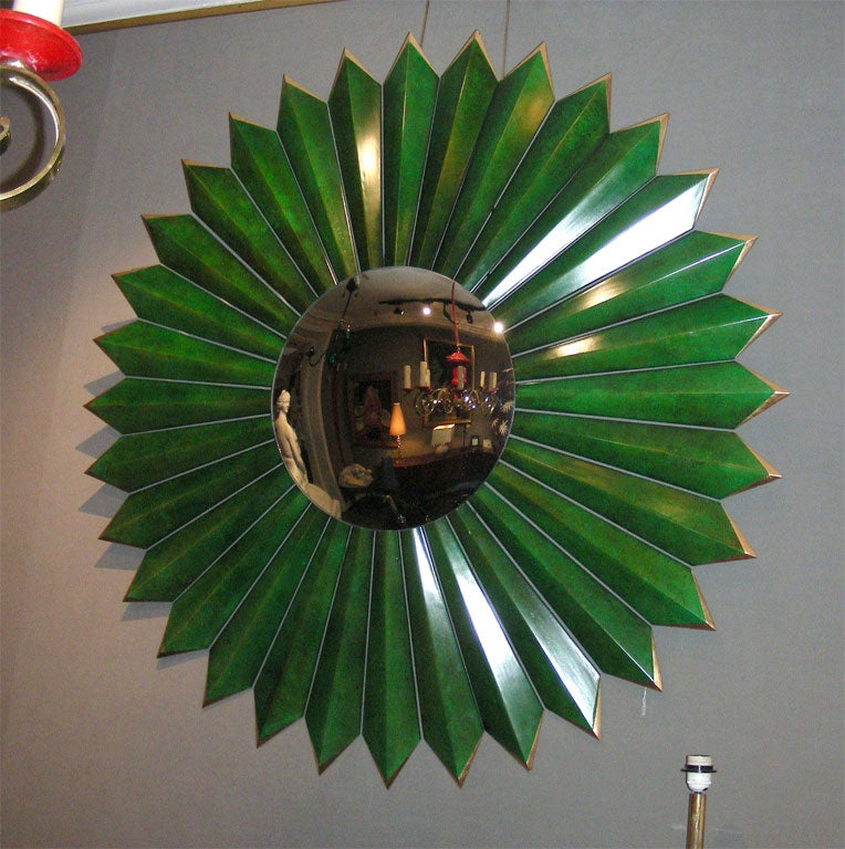 Large sun mirror in a green painted wooden surround with a gilt edge border.  Contemporary creation for a hotel project in Las Vegas