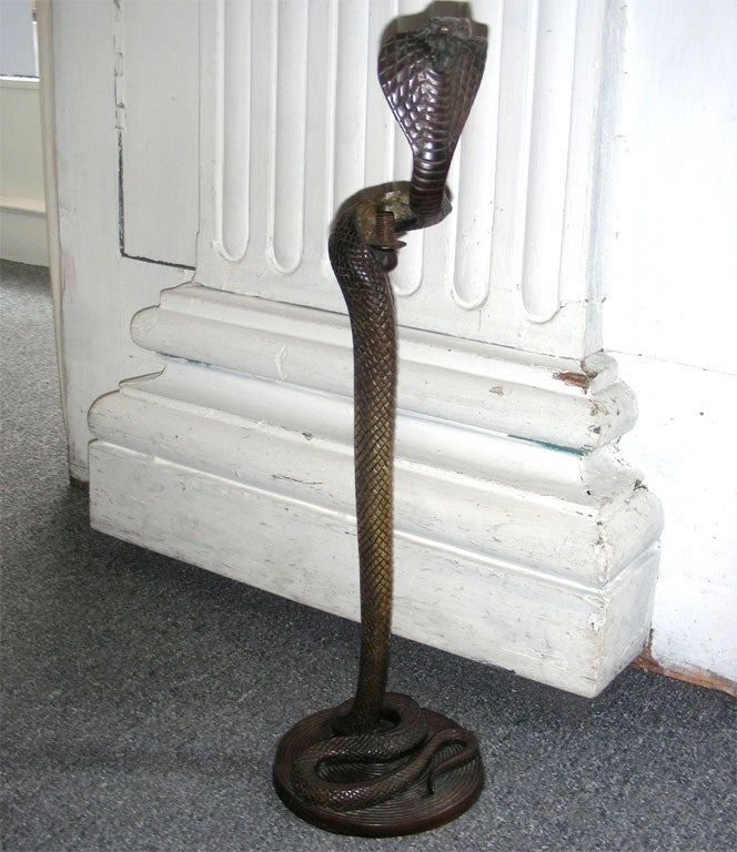 Unusual detailed carving on this snake table lamp signed by Edgar Brandt from the 1920s.