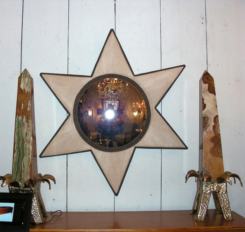 1950s star-shaped mirror in brown leather and white galuchat.