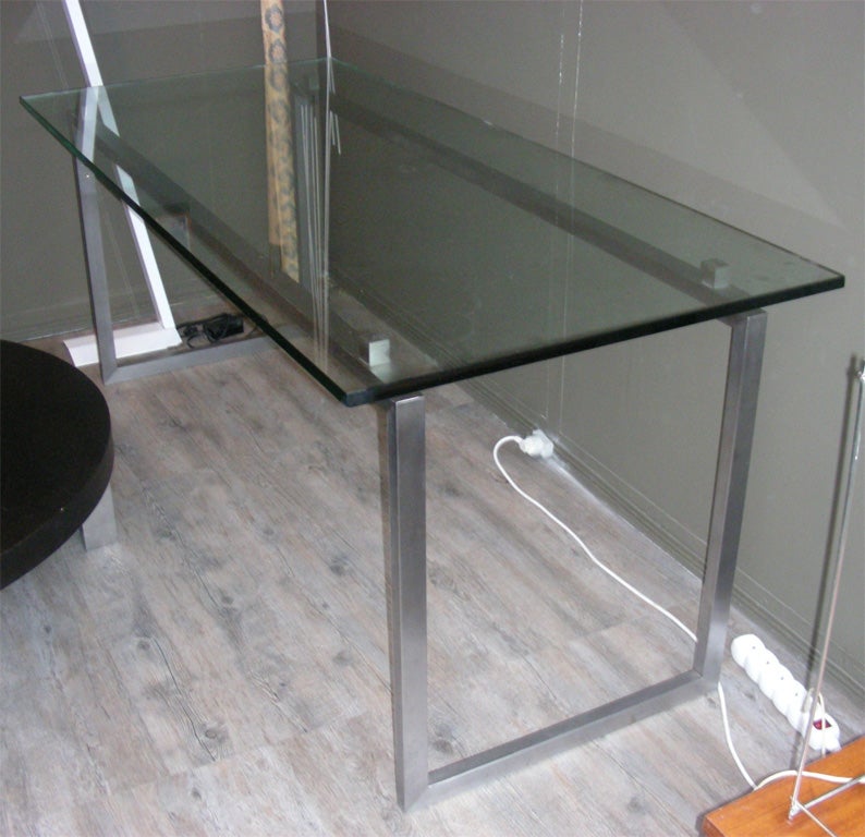 1970s desk or table with base in brushed metal and glass of Saint gobain top 2 cm. thick.