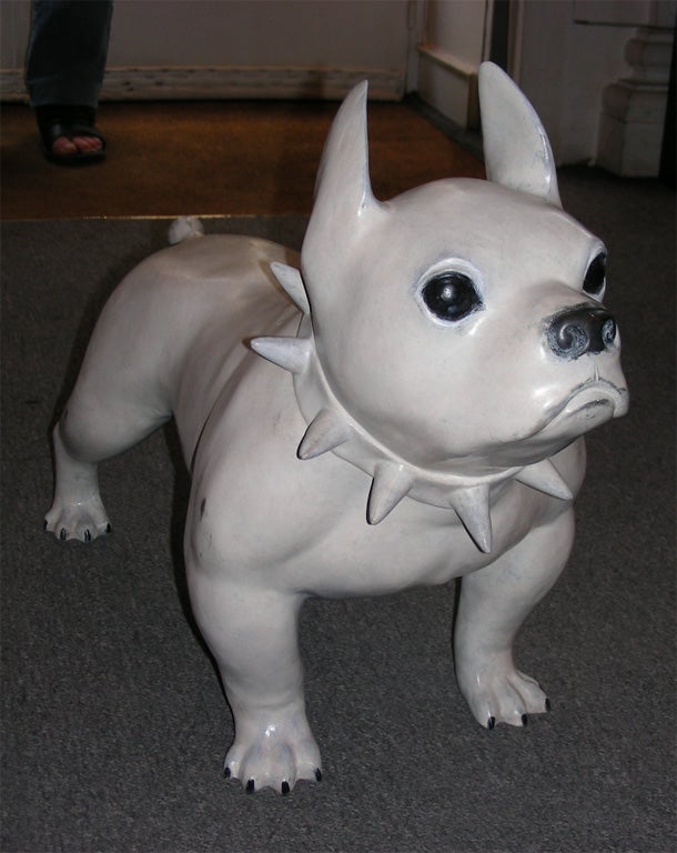 End of 20th century cream-white patina bronze sculpture of a dog with black eyes and nose by Christian Maas, numbered 5/49.