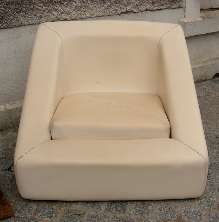 1970s cream leather sofa and two matching armchairs. Armchairs height 65/33 cm., length and depth 85 cm.