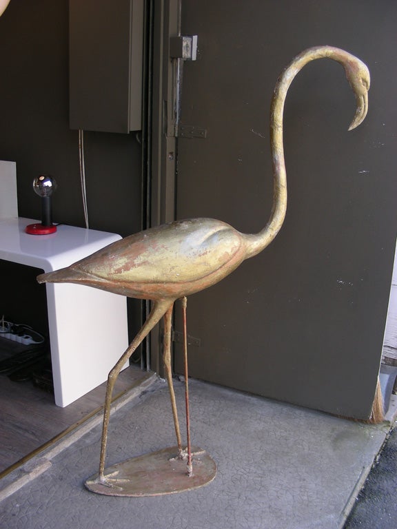 1940s sculpture of a pink flamingo, with an inner structure in wood covered with papier maché gilt with gold leaf.