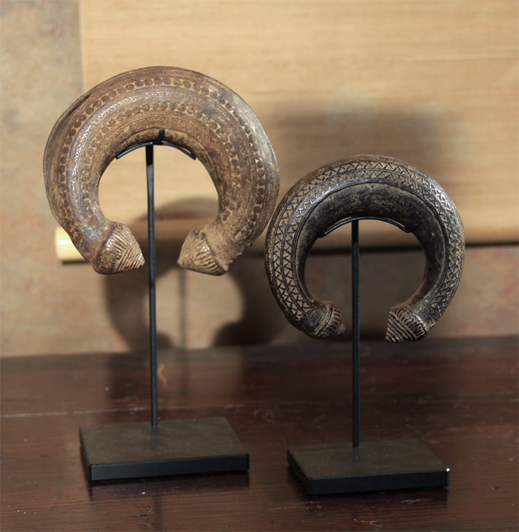 Pair of Khmer cast bronze anklets from Thailand.<br />
Each mounted on a contemporary stand.<br />
<br />
The anklets are also available individually: <br />
Small Anklet, $525. 7