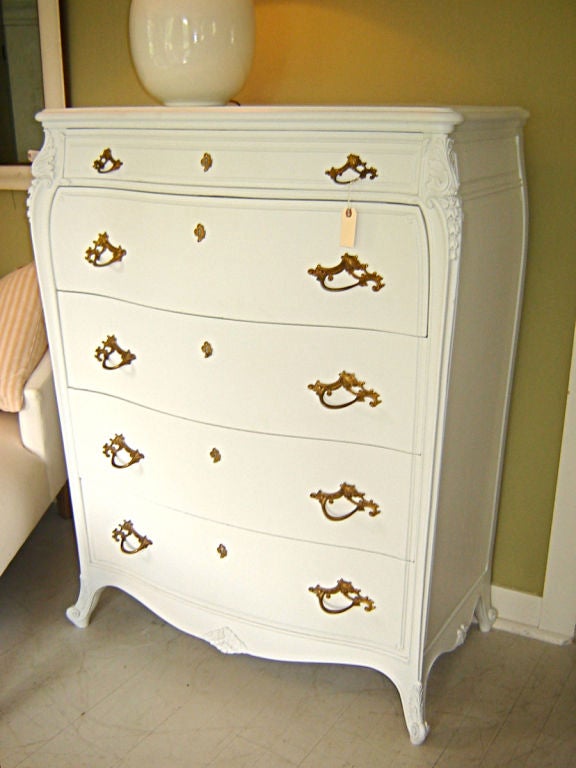 Curved front painted tall chest with original hardware. Finish is new.
