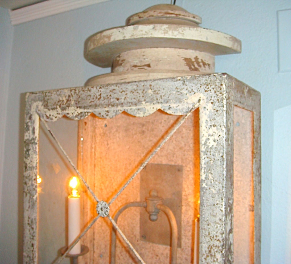 Tole wall lantern with traces of original paint and great age patina. Newly rewired with double candle fixures.