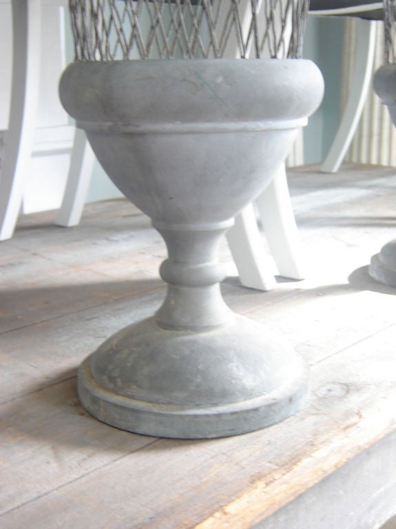 Large pair of zinc and wire urns.