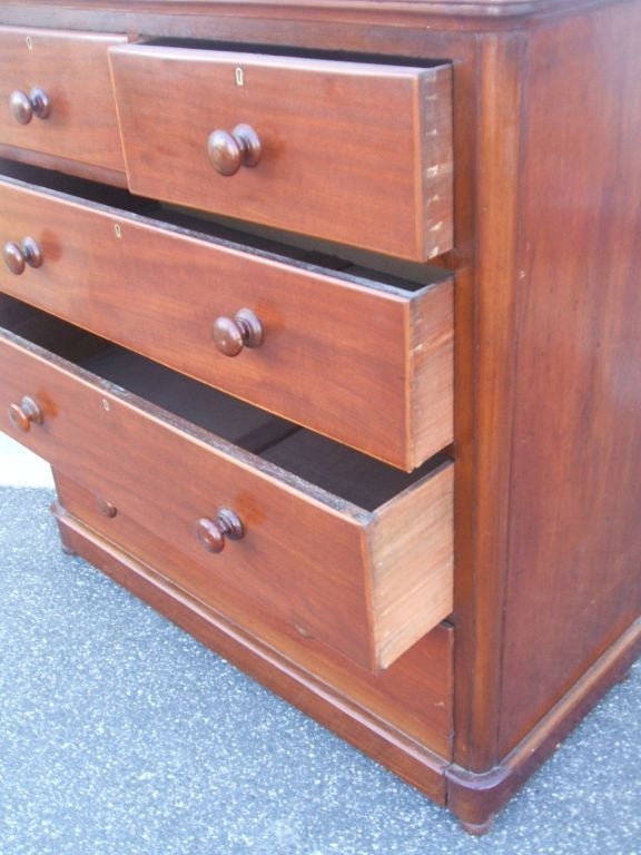 Mahogany veneer four-drawer chest.