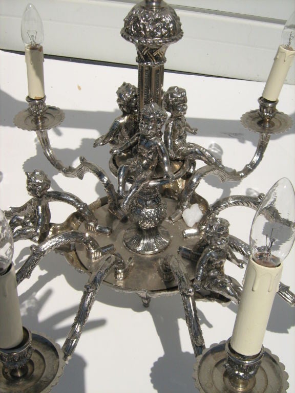 Silver-plated 9 arm chandelier.Electified US way