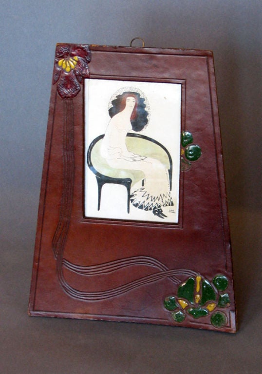 A Jugendstil period picture frame executed in leather with polychrome floral decoration in enamel, Vienna, circa 1910.
