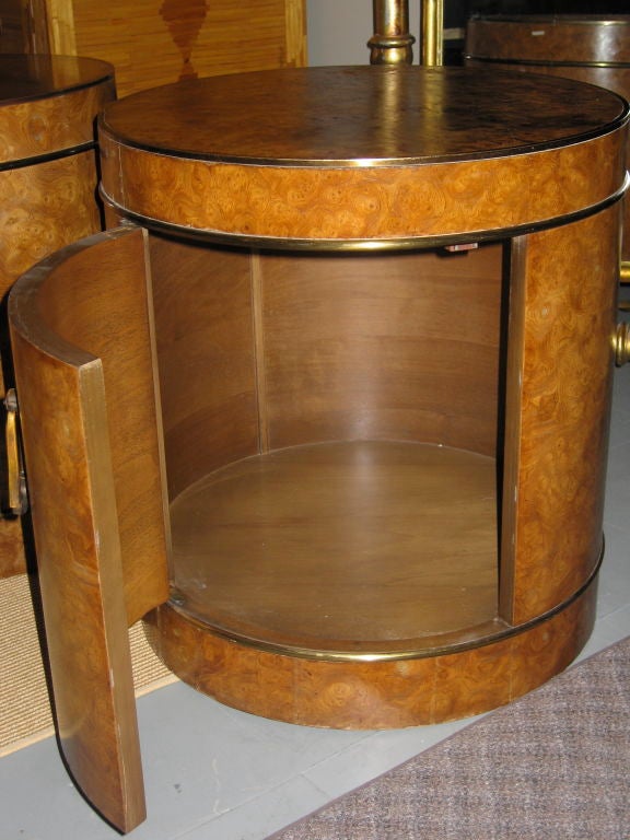 Burled maple drum tables with brass trim