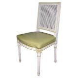 Set of Fourteen Louis XVI Style Cane Dining Chairs by Jansen