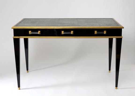 Important rectangular Desk / Writing Table <br />
attributed to Maison Jansen.<br />
Shagreen covered writing surface, lacquered fruitwood, gilt-bronze ornaments & glass.