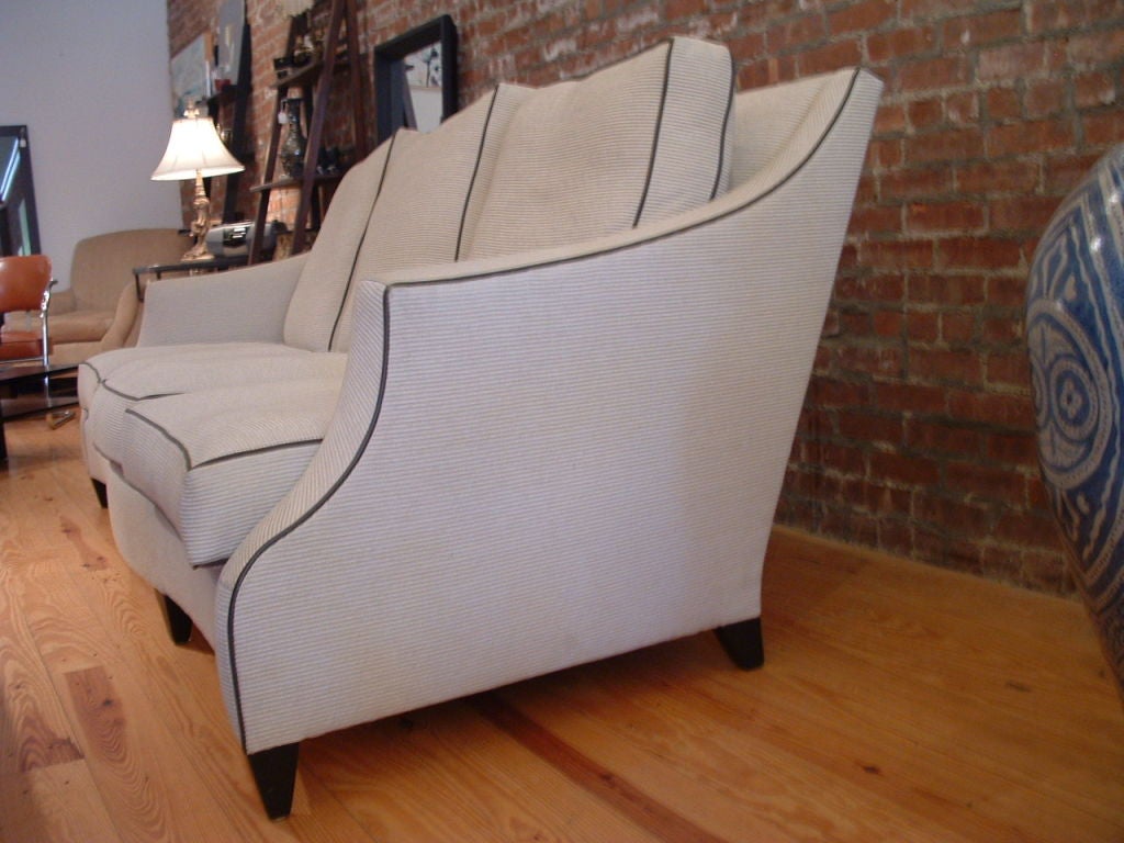 Original Donghia sofa finished in cotton ottoman with leather trim.  Beautiful design.  Height - 35