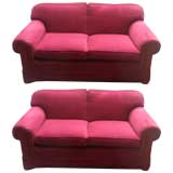 pair of lush upholstered love seats
