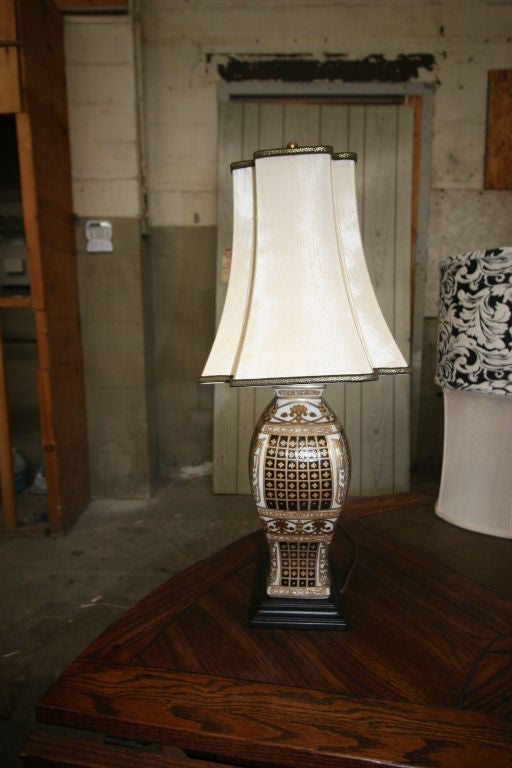 Pair of Chinese inspired vase with lamp application. With a tierd, flaired lamp silk shade.