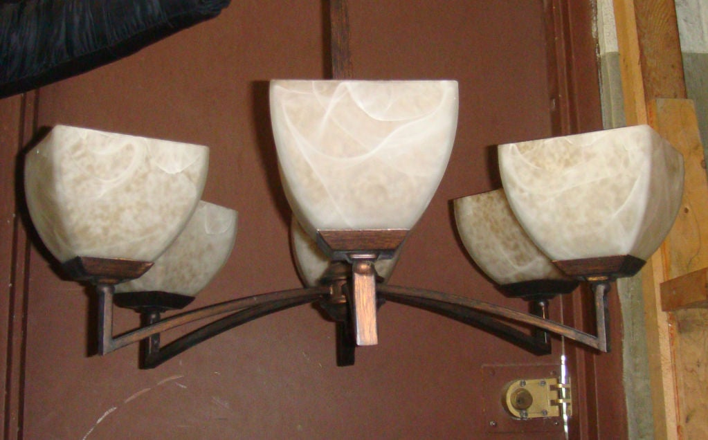 Modern style chandelier.Alabaster shades.Great effect with light.

Contact us for more info