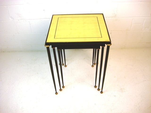 Set of Three Vintage Nesting Tables with Black Metal Frames with Gold Details, and Gold Eglomise Glass on Tops, <br />
French, Circa 1940
