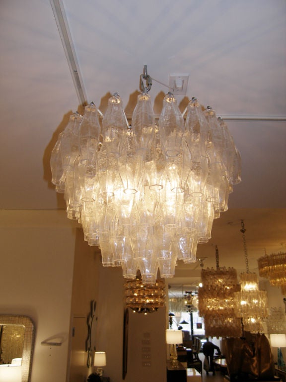 Venini Polyhedral Clear Glass Chandelier<br />
<br />
Venini was founded in 1921 in the Italian glass making capital of Murano-- in truth an island in the waters surrounding Venice. Venini is still active to this day producing high quality