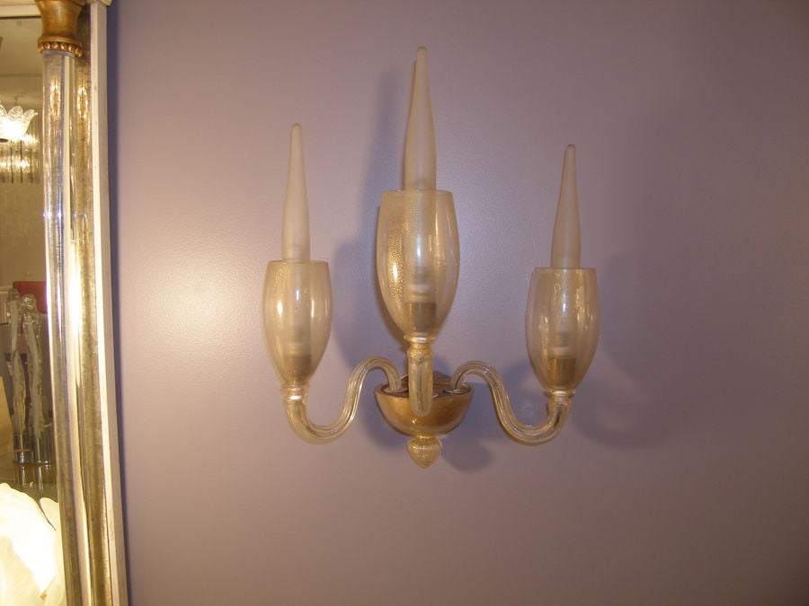 Pair of Barovier 3 arm gold glass sconces.