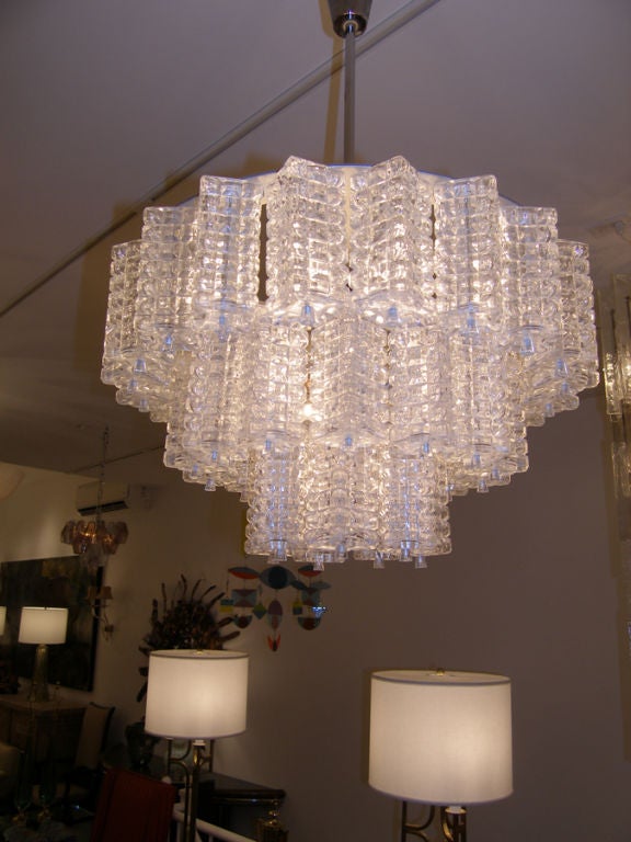 Orrefors three-tiered crystal chandelier with nickel hardware.