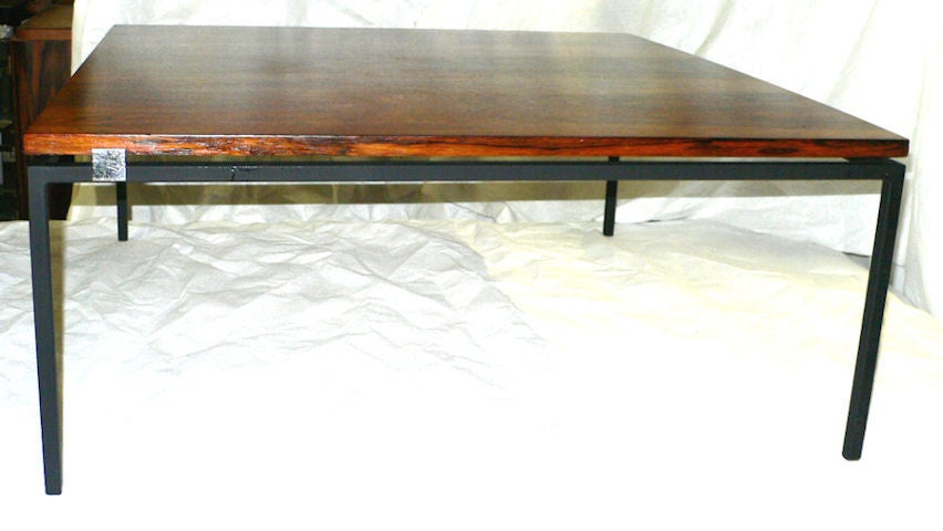 rosewood table with lacquered metal base designed by Michel Dumas in the 1970's