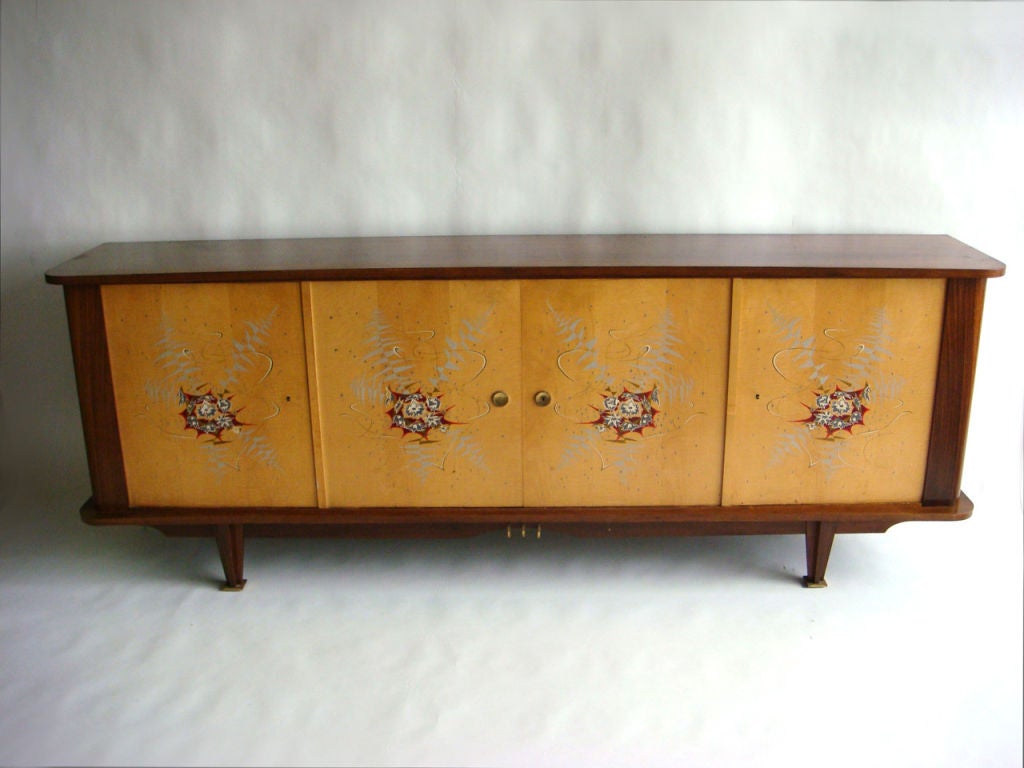 Fine French mid-century rosewood and sycamore sideboard with original four painted doors and brass details.
 