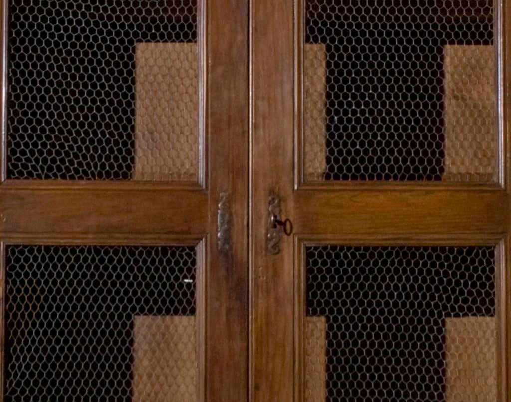 FRENCH ARMIORE WITH CHICKEN WIRE PANELS ON THE DOORS.PREFECT FOR KITCHEN STORAGE!FRENCH FRUITWOOD IN DARK COLOR,SOME FLUTING ON DOOS,3 SHELVES